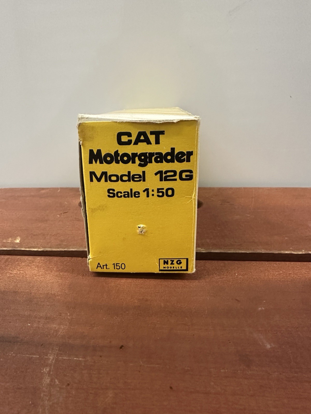 NZG Caterpillar 12G Construction Yellow Motor Grader with Original Packaging