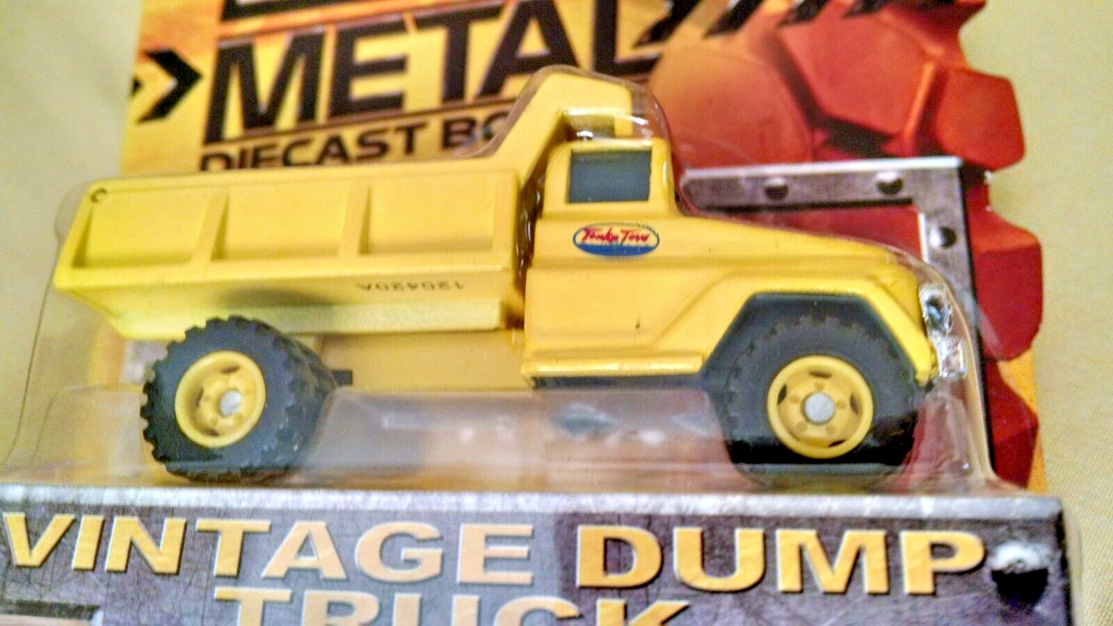 TONKA DUMP TRUCK METAL DIECAST BODIES ITEM NO 06402 NEW 2012 SEALED TOY YELLOW.
