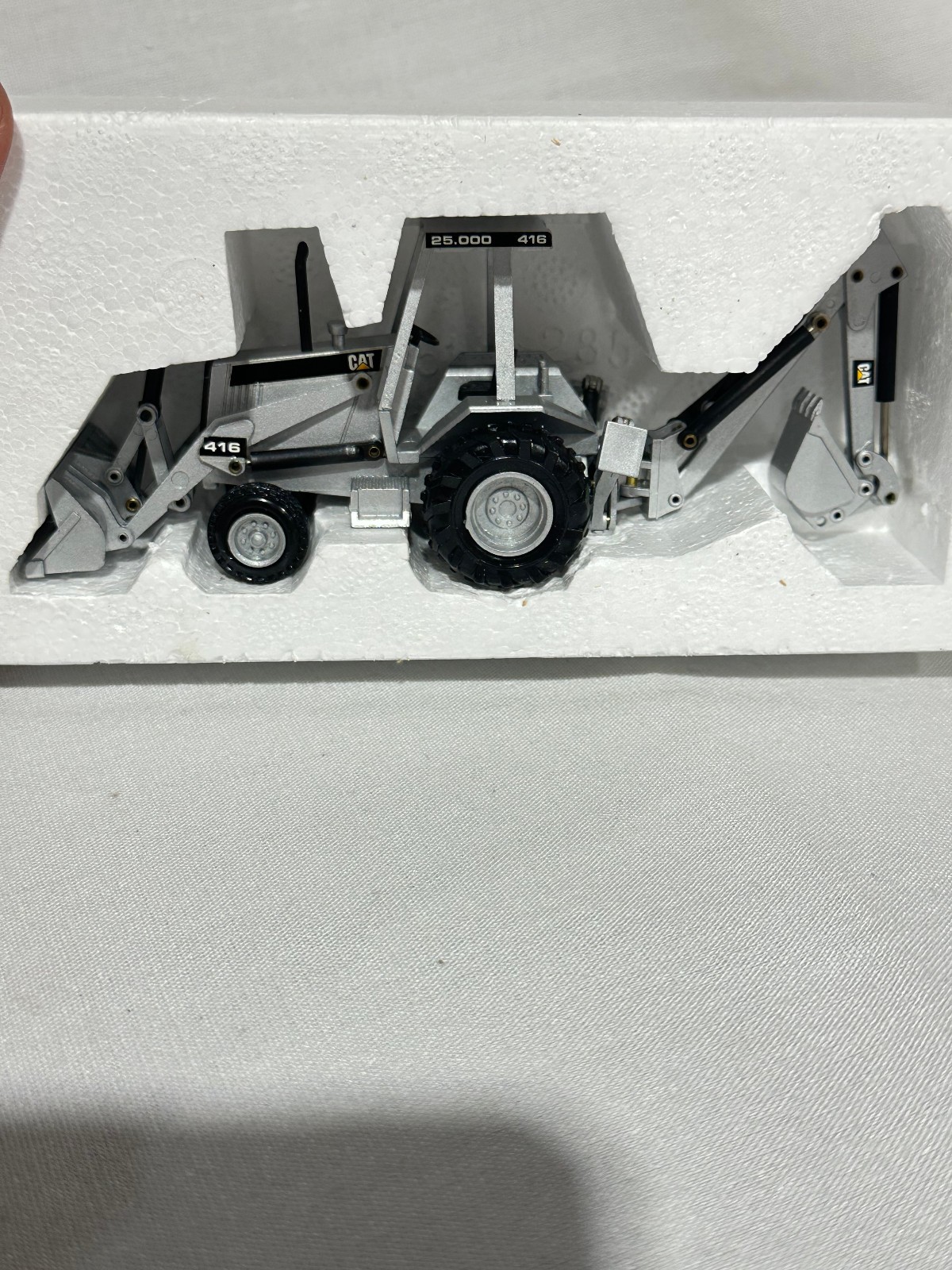 Caterpillar 416 Backhoe Loader 25,000th Silver Edition By NZG 1/50th Scale