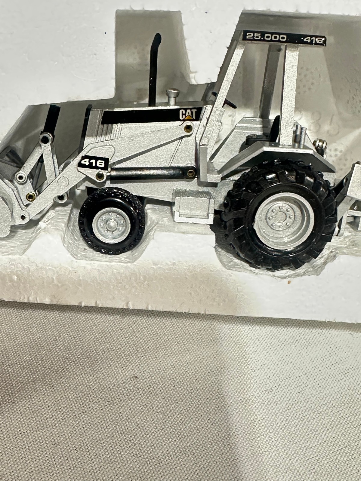 Caterpillar 416 Backhoe Loader 25,000th Silver Edition By NZG 1/50th Scale
