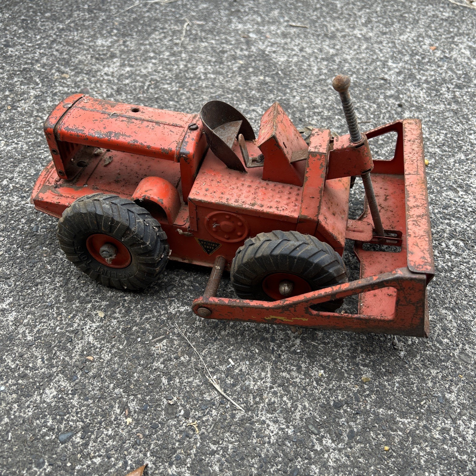 1950’s Vintage NYLINT Tournatractor Dozer. Orange Pressed Steel -Rubber Wheels
