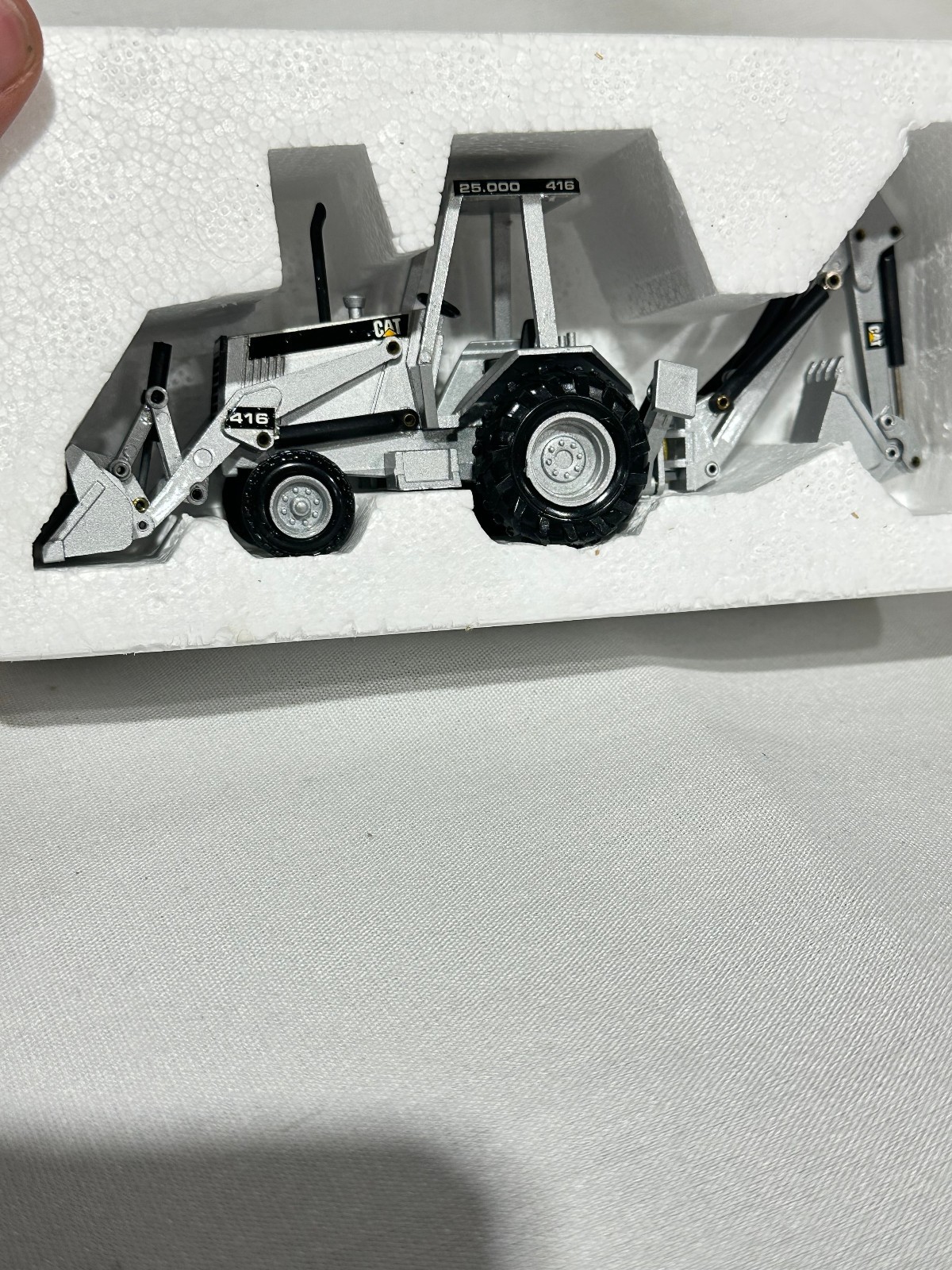 Caterpillar 416 Backhoe Loader 25,000th Silver Edition By NZG 1/50th Scale