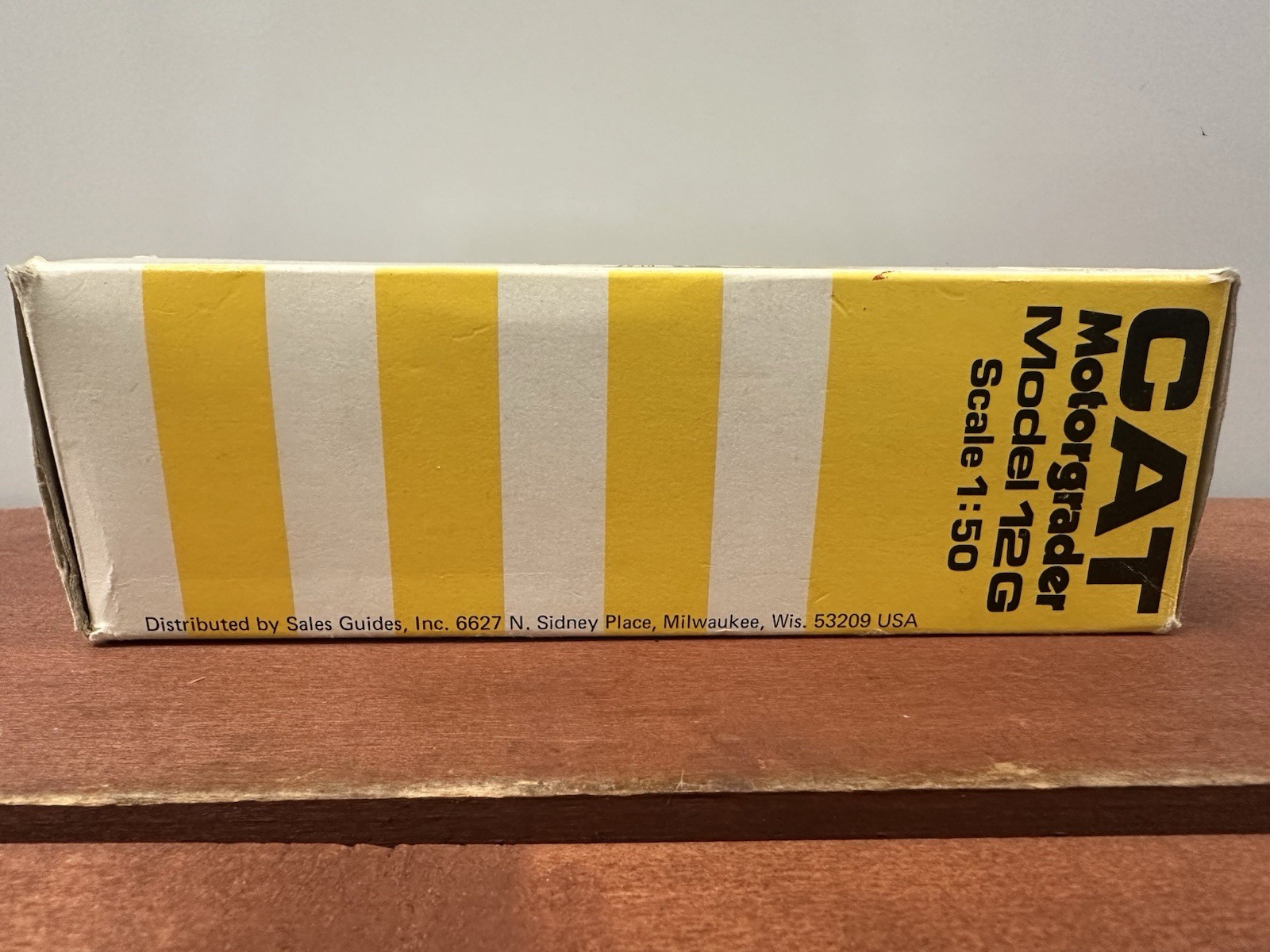 NZG Caterpillar 12G Construction Yellow Motor Grader with Original Packaging