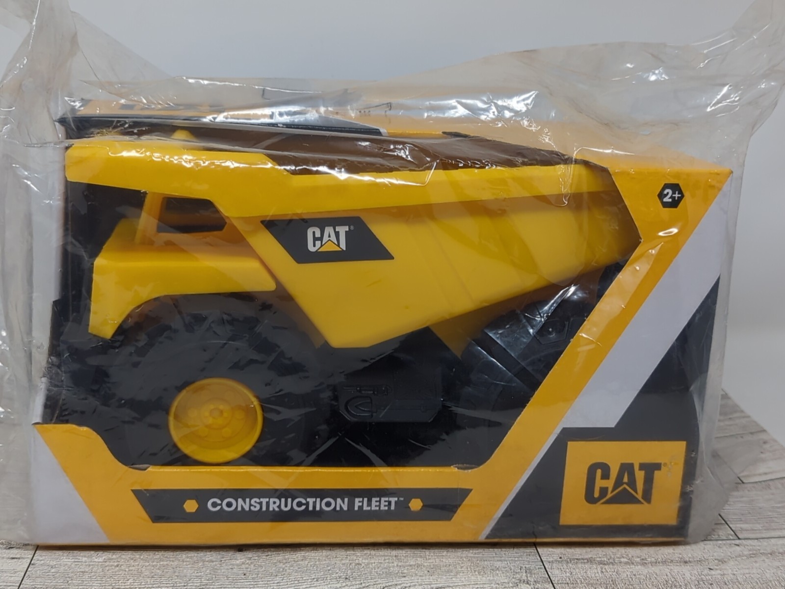 CAT Construction Fleet Dump Truck 82021 Yellow Black Plastic 10″ Push Powdered