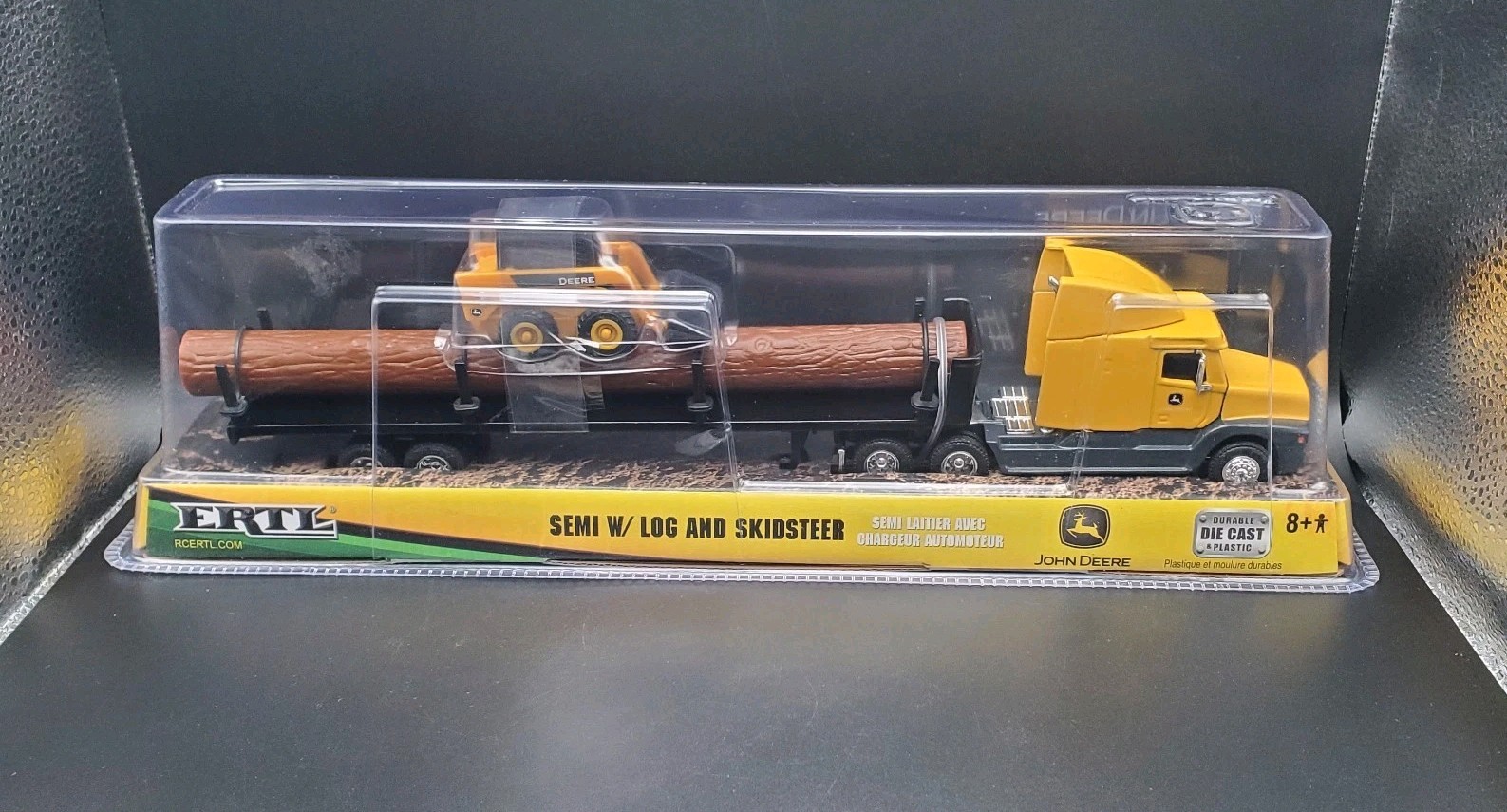 JOHN DEERE – ERTL SEMI W/ LOG AND SKIDSTEER 37382