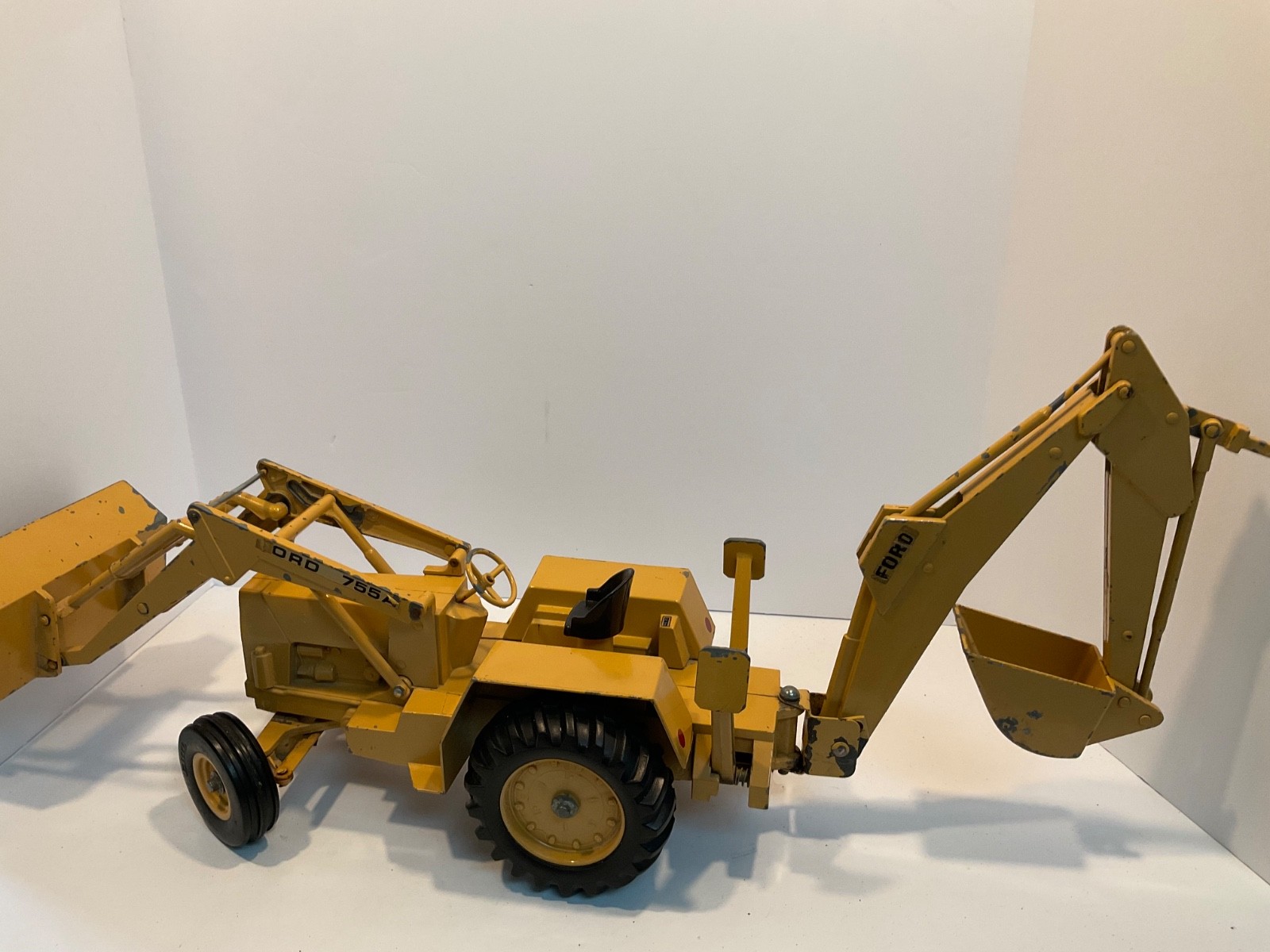 Vintage Ertl Ford 755A Backhoe Loader 1/12 for parts or restoration.