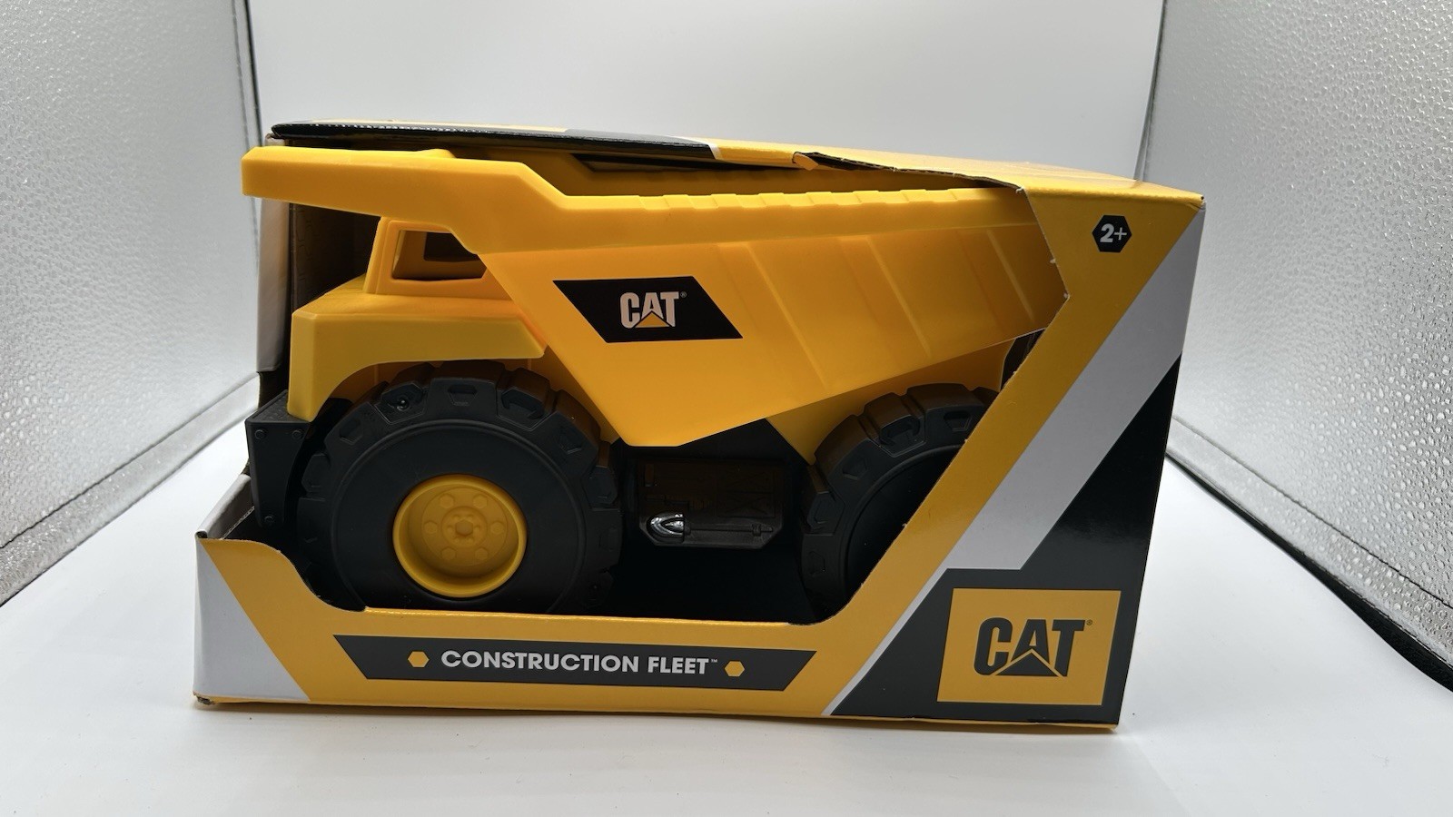 CAT Construction Fleet Dump Truck 82021 Yellow Black Plastic 10″ Push Powdered