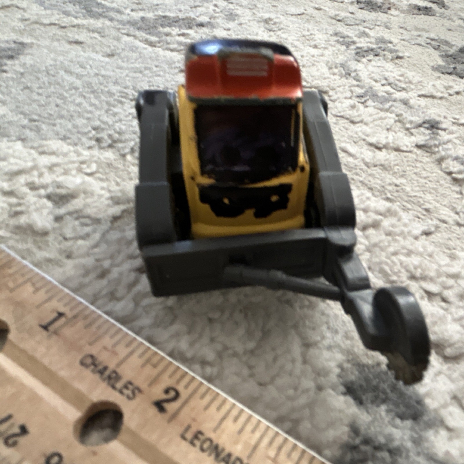 Yellow Black Orange Plastic Construction Vehicle Toy with Rotating Saw Arm