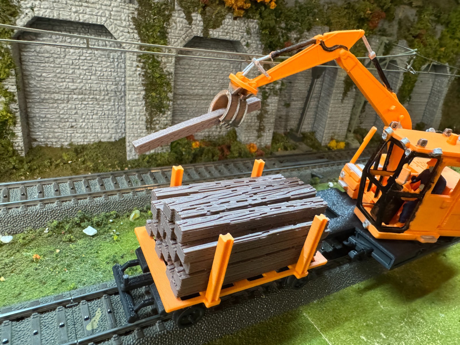 O scale Cat Railroad Tie Loader with loaded cart in Orange unpainted