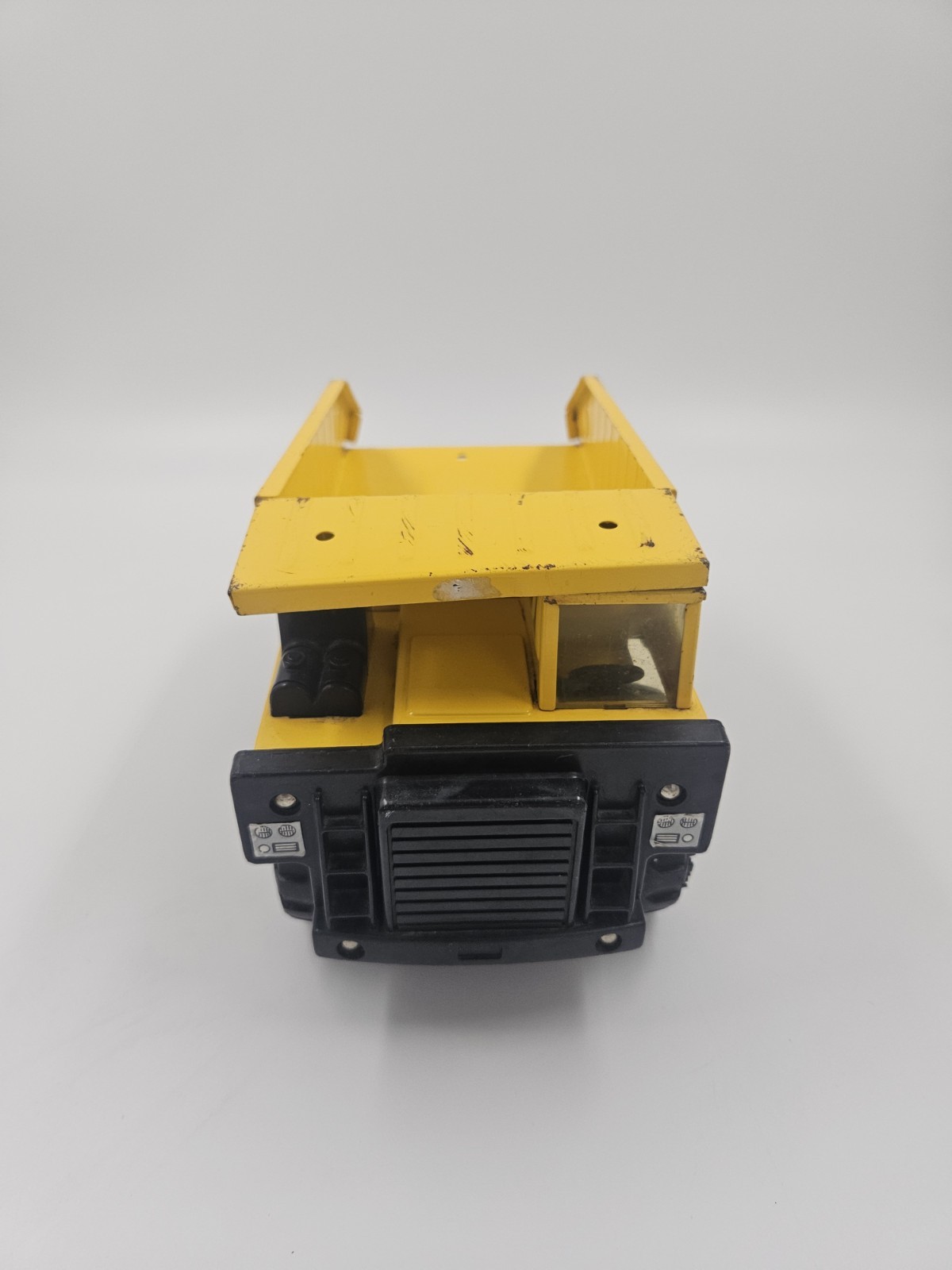 Vintage 1986 Remco Caterpillar Dump Truck Yellow Pressed Steel