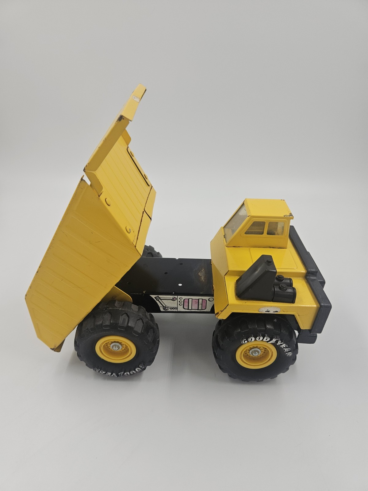 Vintage 1986 Remco Caterpillar Dump Truck Yellow Pressed Steel