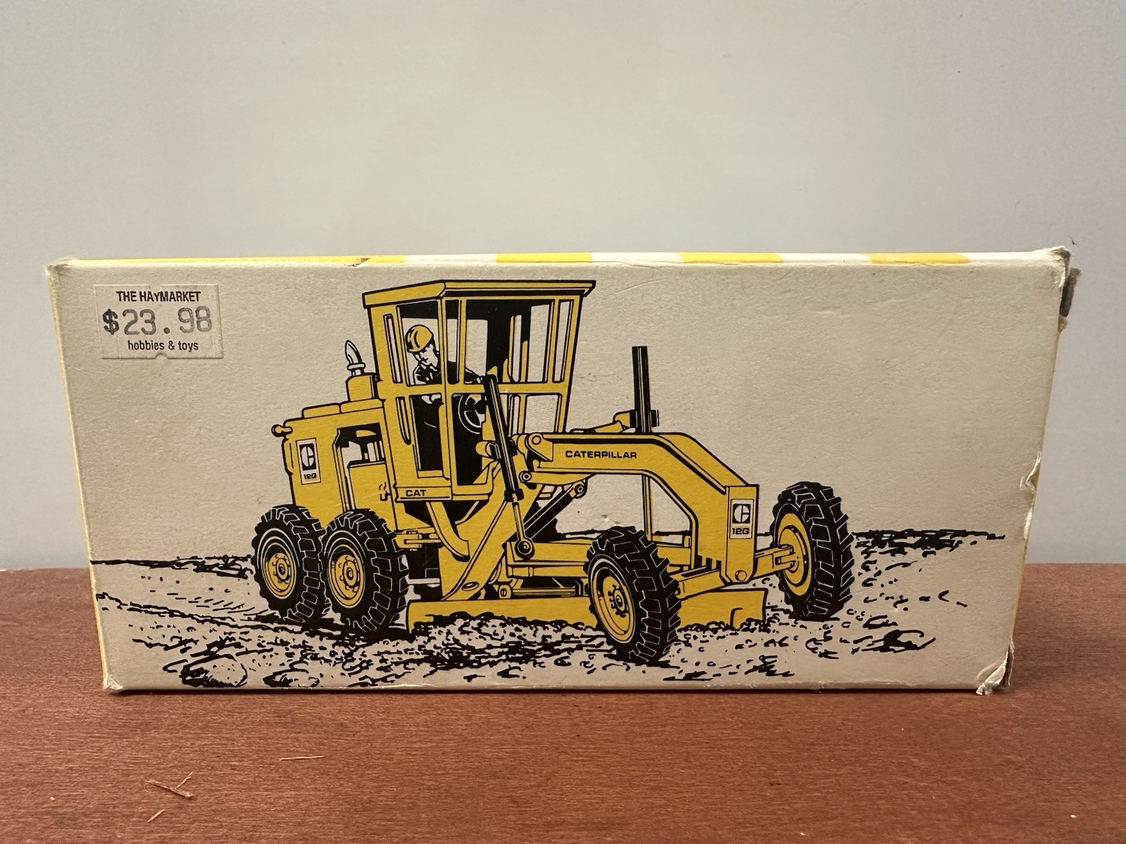 NZG Caterpillar 12G Construction Yellow Motor Grader with Original Packaging