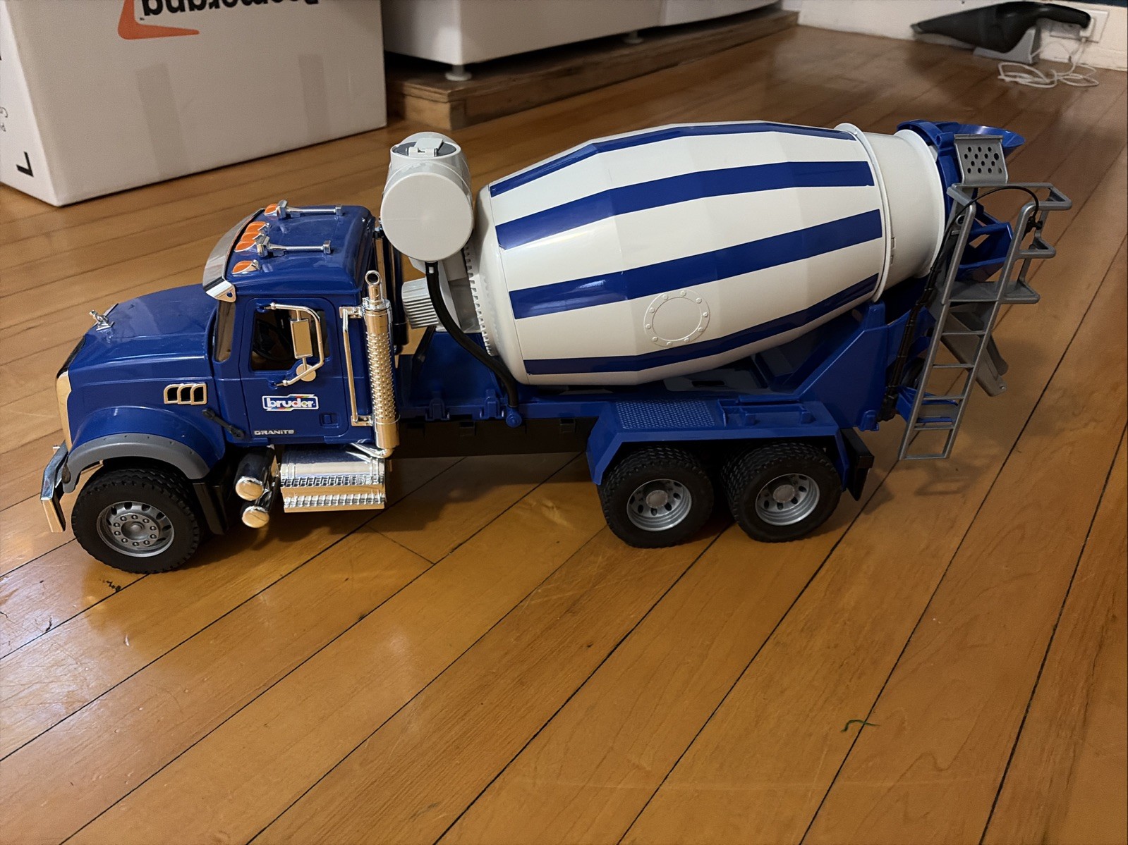 Lot Of Three Bruder Trucks Logger, Cement Truck, Cat Bucket Loader