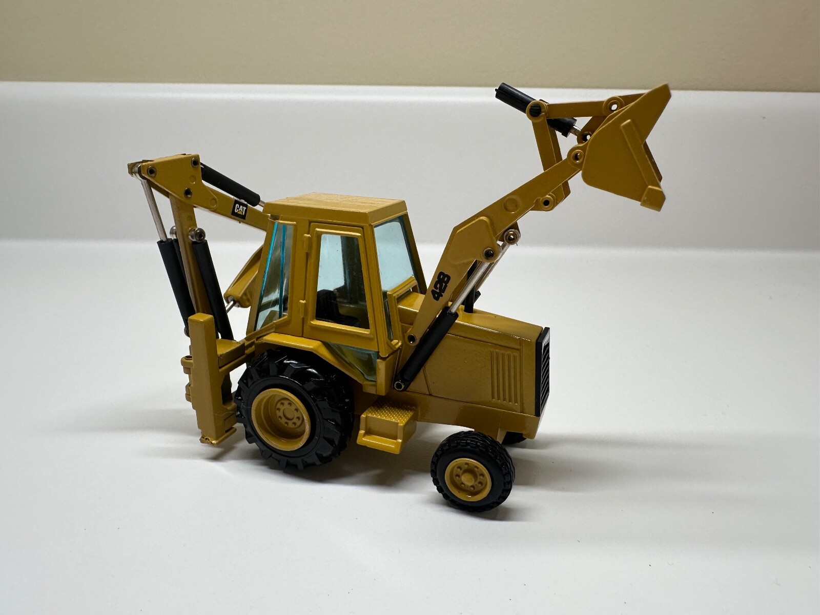 NZG Gehl 4610 Skid Steer Loader 1:25 & Caterpillar 428 backhoe loader 1:50