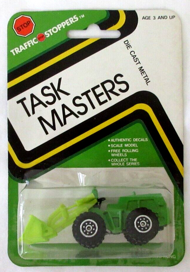 YATMING HONG KONG TRAFFIC STOPPERS TASK MASTERS TRACTOR SHOVEL, MINT ON CARD