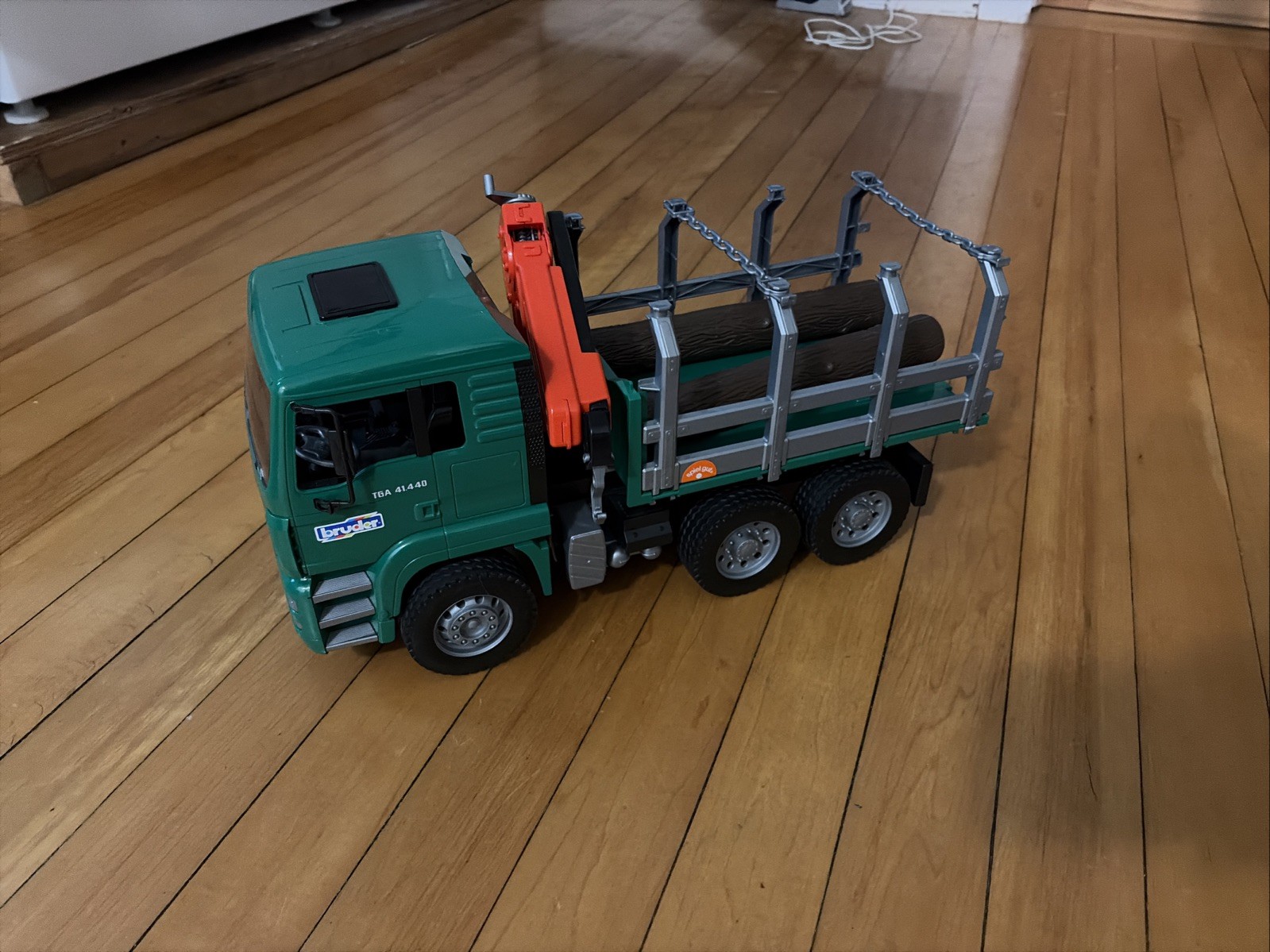Lot Of Three Bruder Trucks Logger, Cement Truck, Cat Bucket Loader