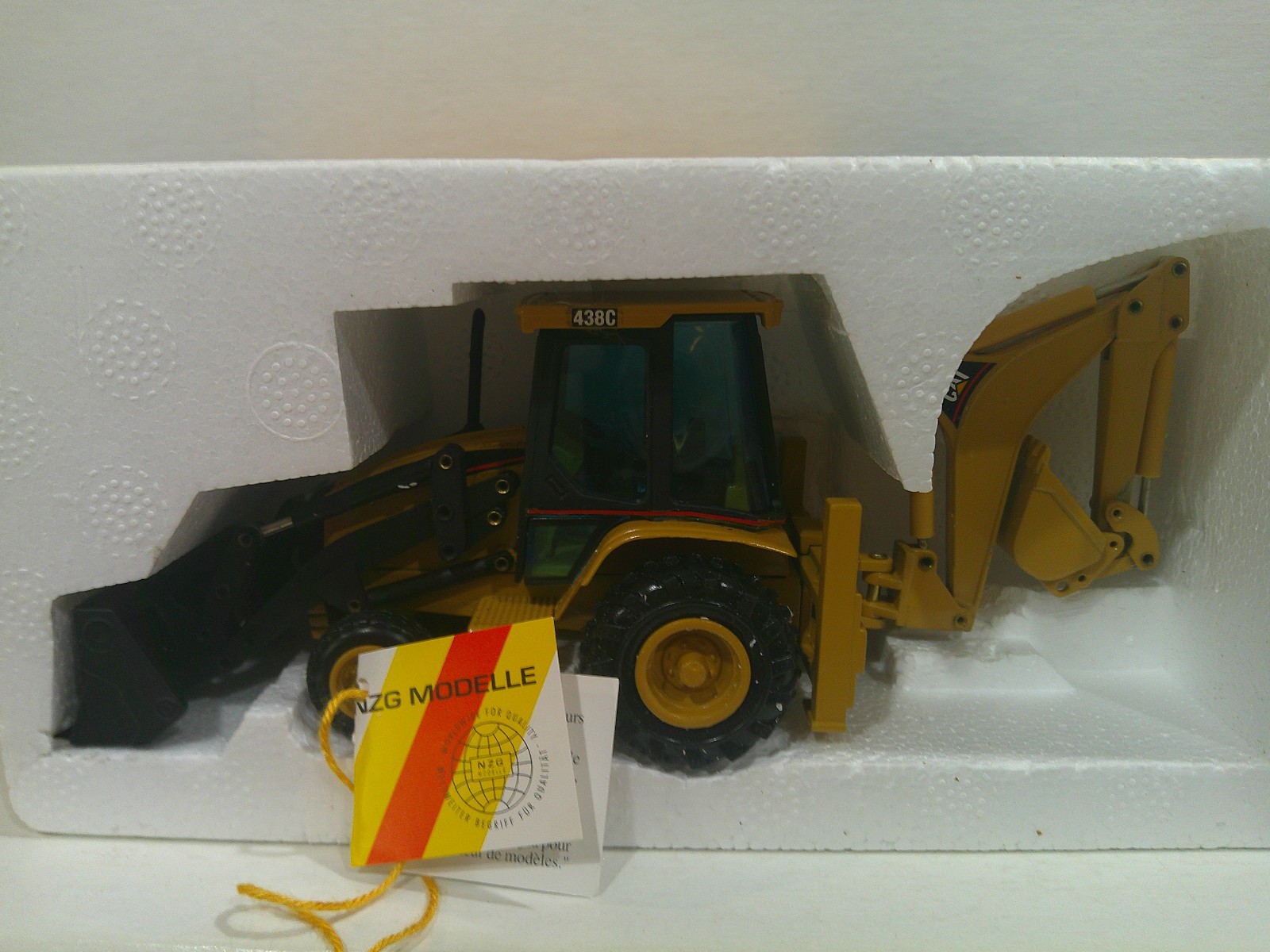 NZG CAT 438C Backhoe Loader Official Launch Edition #430 1:50 Yellow VG Box