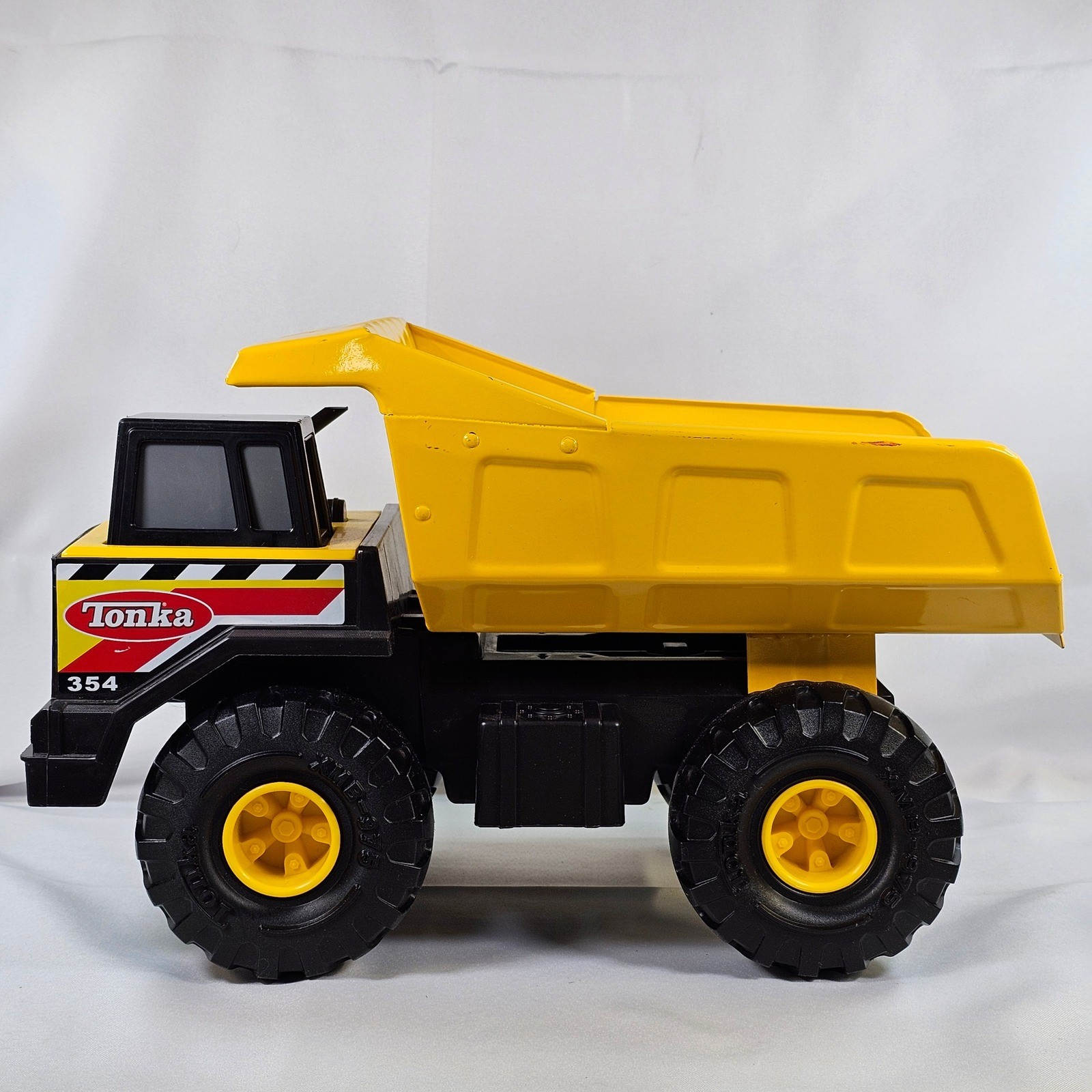 Tonka 354 Mighty Dump Truck Yellow Steel Bed Construction Toy Vehicle 17 Inch