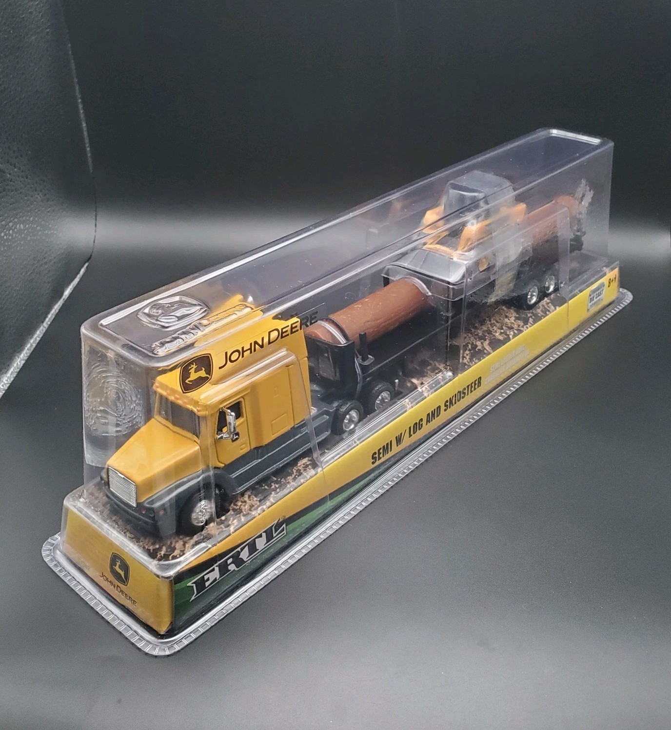 JOHN DEERE – ERTL SEMI W/ LOG AND SKIDSTEER 37382