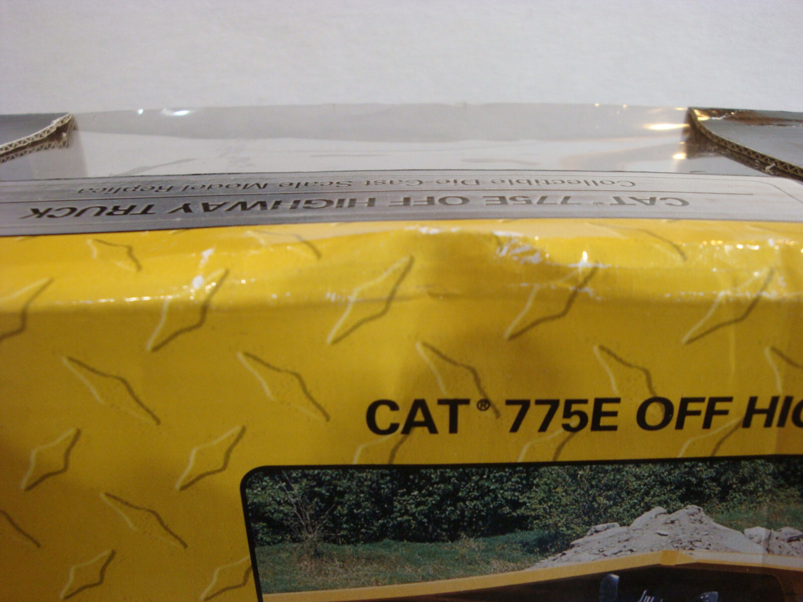 Norscot 1:64 Scale CAT 775E Off Highway Truck Yellow Fair Box