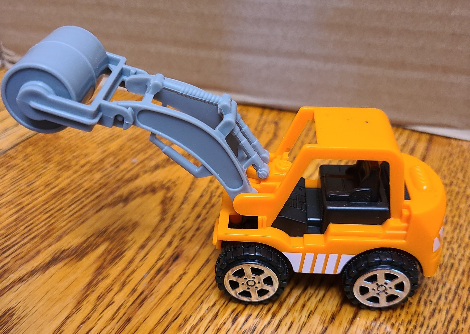 2 mini plastic construction toys Excavator and road roller