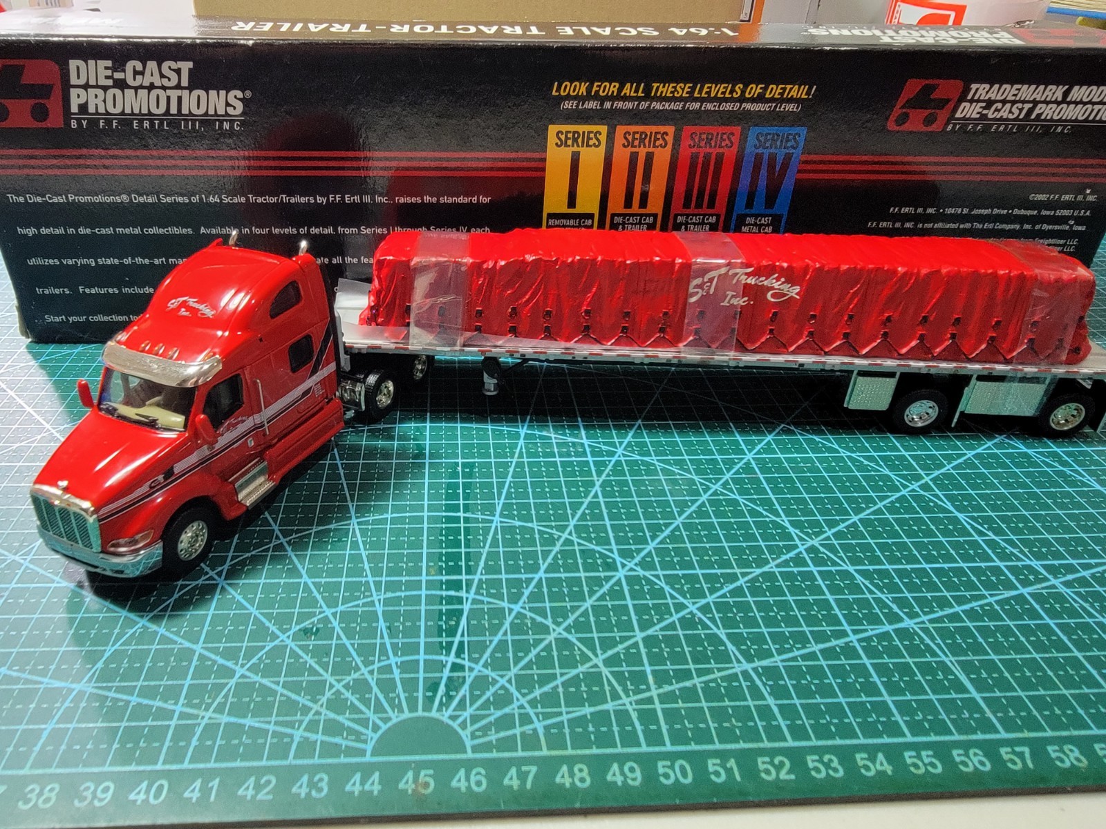 DCP 1:64 S&T Trucking Inc Red Peterbilt Tractor Trailer Used Box