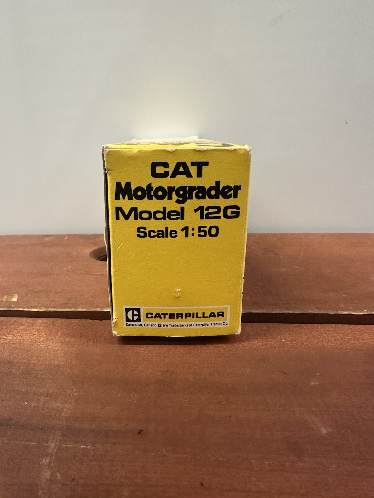 NZG Caterpillar 12G Construction Yellow Motor Grader with Original Packaging