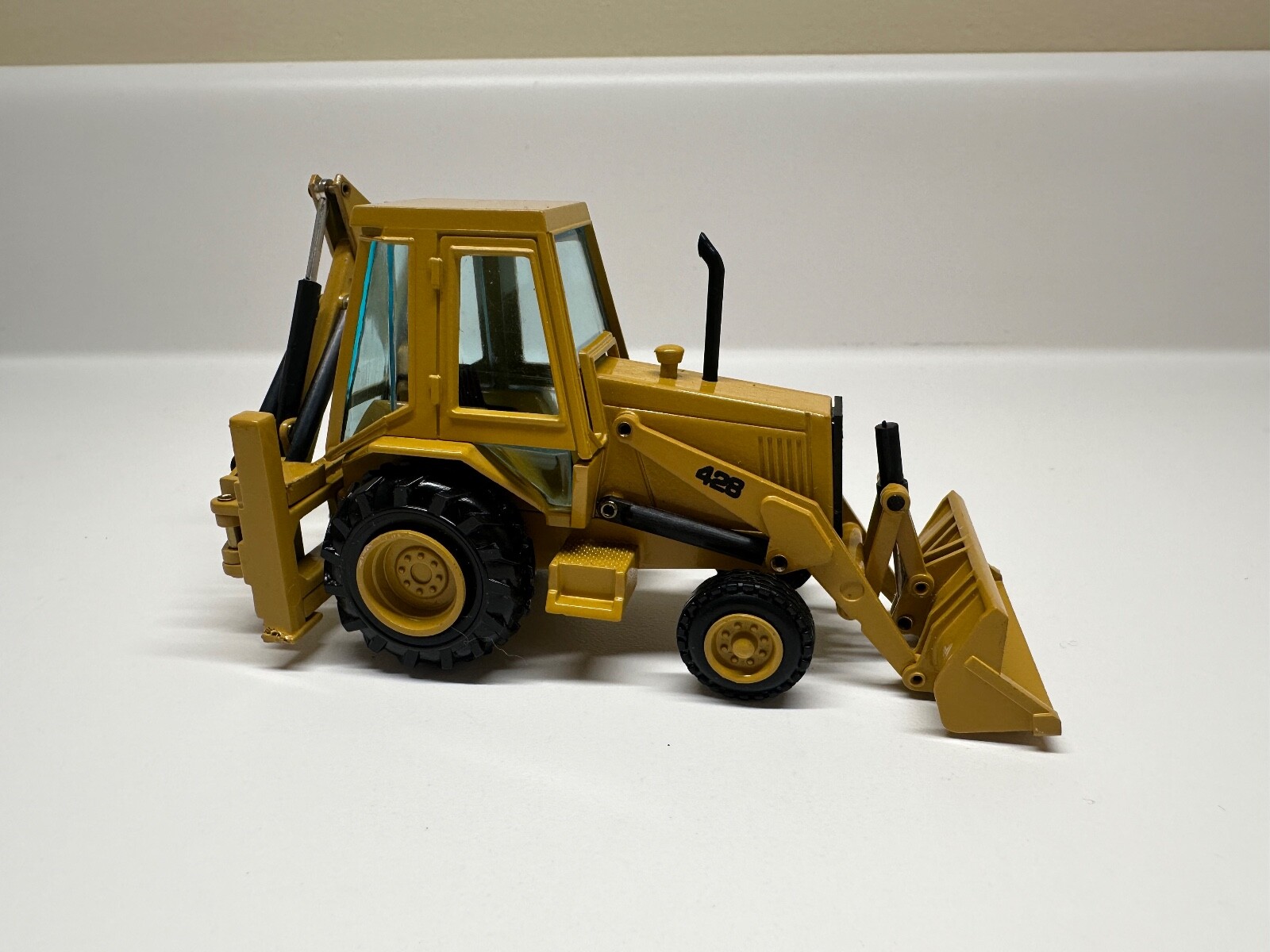 NZG Gehl 4610 Skid Steer Loader 1:25 & Caterpillar 428 backhoe loader 1:50
