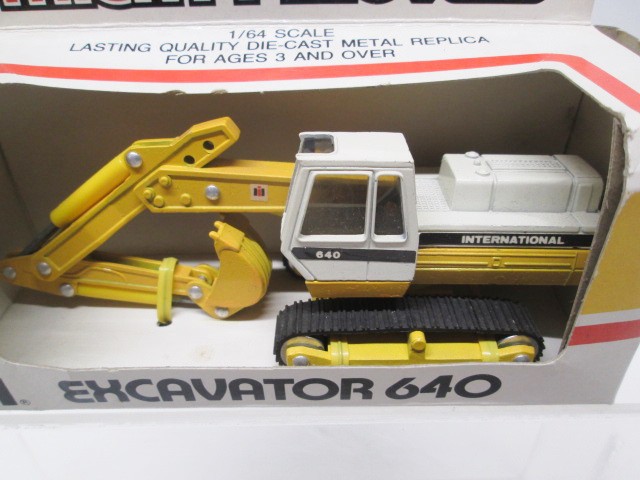ERTL 1/64 MIGHTY MOVERS INTERNATIONAL CONSTRUCTION TOYS – LOT OF 4 – MINT-IN-BOX