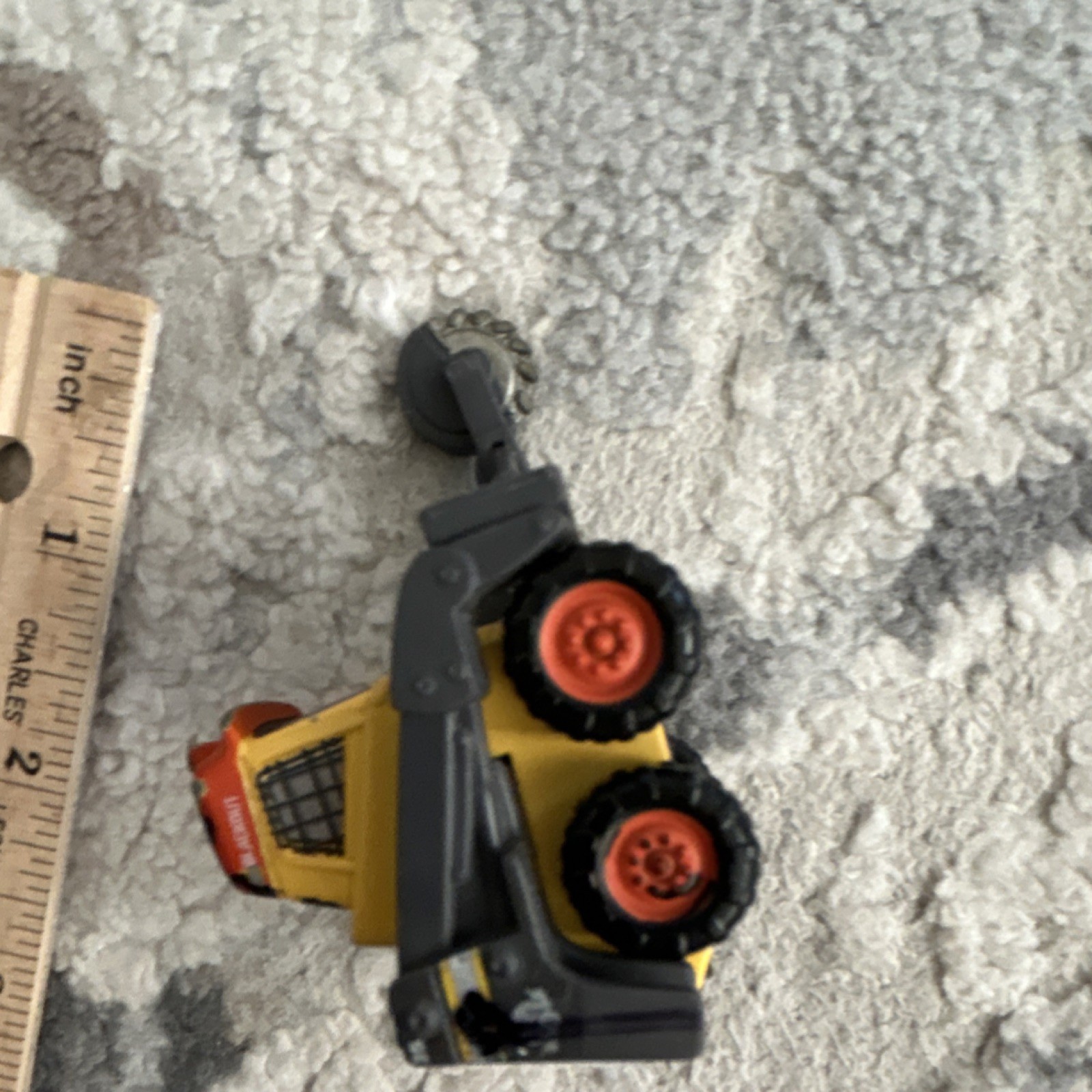 Yellow Black Orange Plastic Construction Vehicle Toy with Rotating Saw Arm