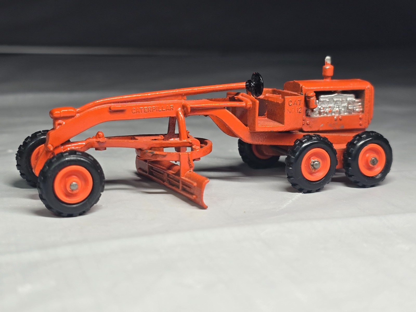 Hong Kong copy of a Mini Dinky #8012 Caterpillar Road Grader Diecast 4″