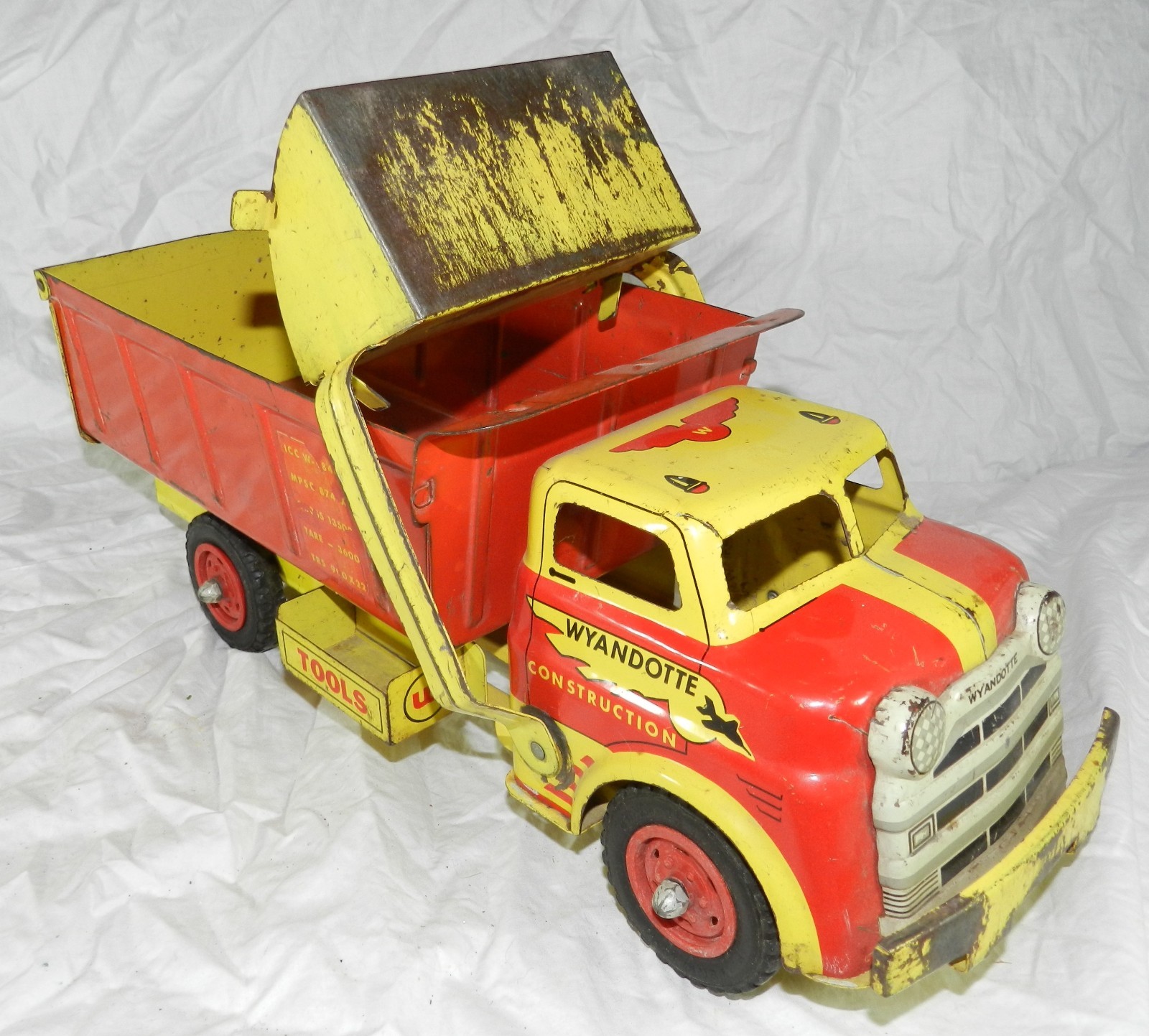 Vintage Wyandotte Pressed Steel Construction Loader Dump Truck – 19.5″ long