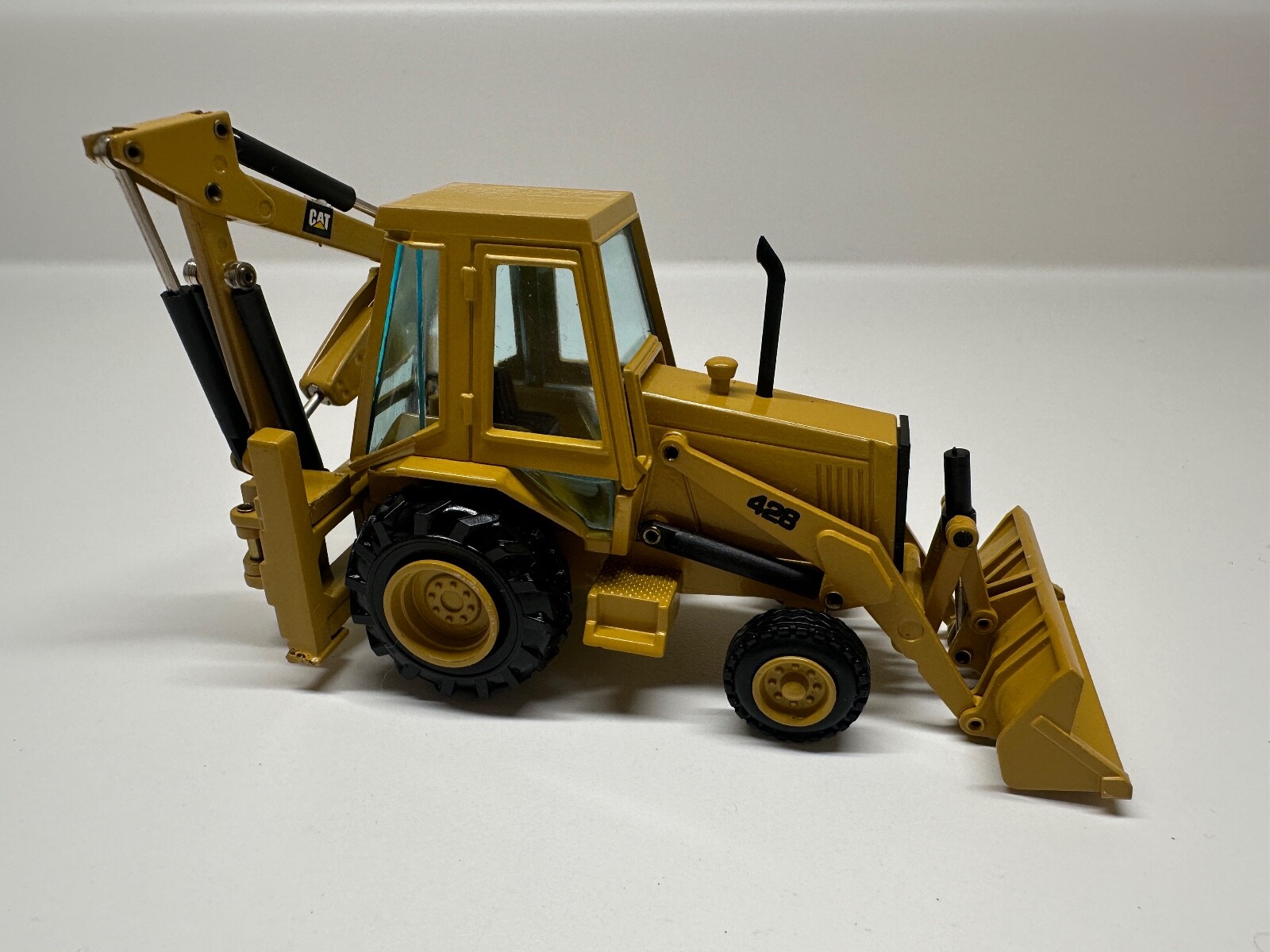 NZG Gehl 4610 Skid Steer Loader 1:25 & Caterpillar 428 backhoe loader 1:50