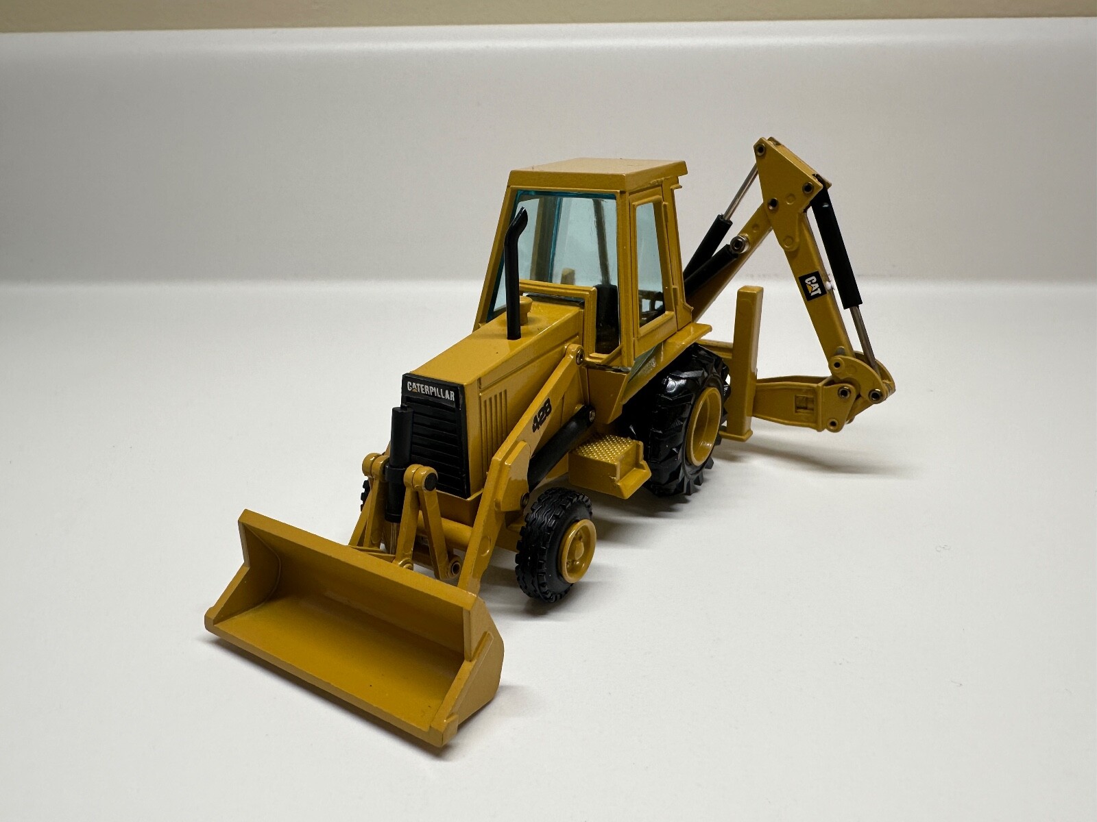 NZG Gehl 4610 Skid Steer Loader 1:25 & Caterpillar 428 backhoe loader 1:50