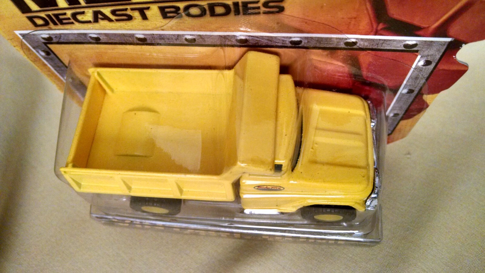 TONKA DUMP TRUCK METAL DIECAST BODIES ITEM NO 06402 NEW 2012 SEALED TOY YELLOW.