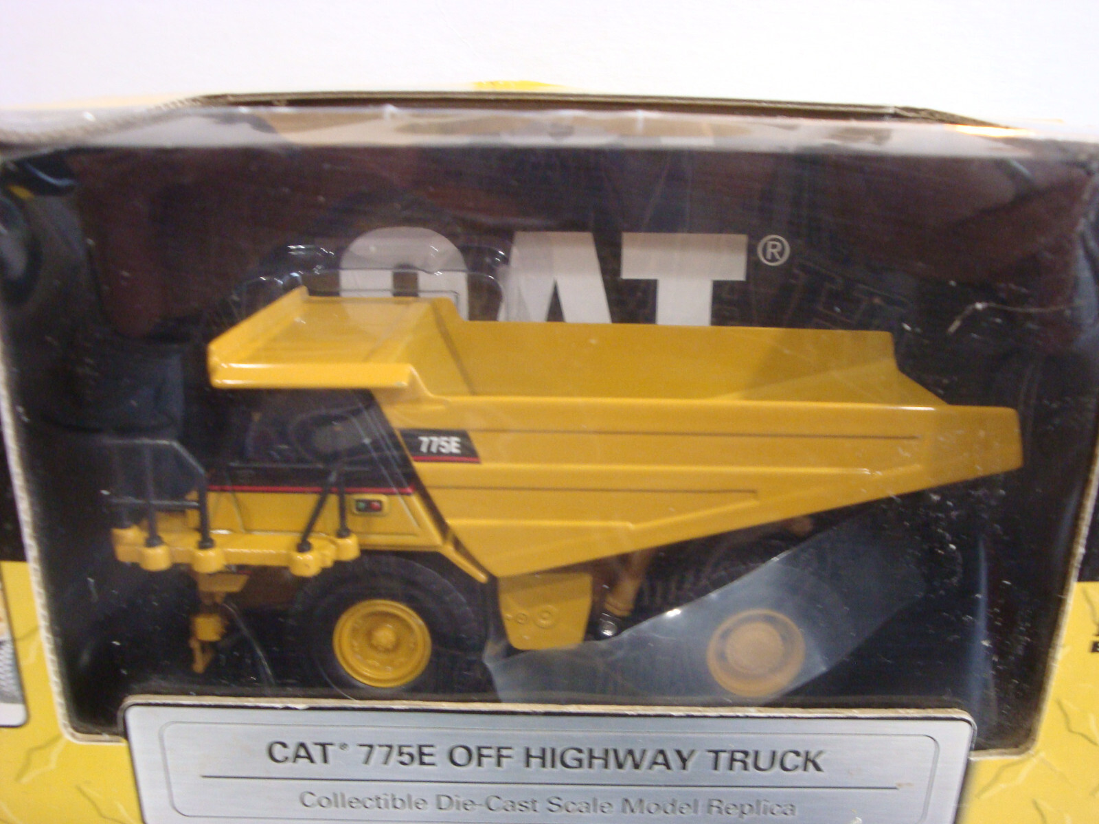 Norscot 1:64 Scale CAT 775E Off Highway Truck Yellow Fair Box