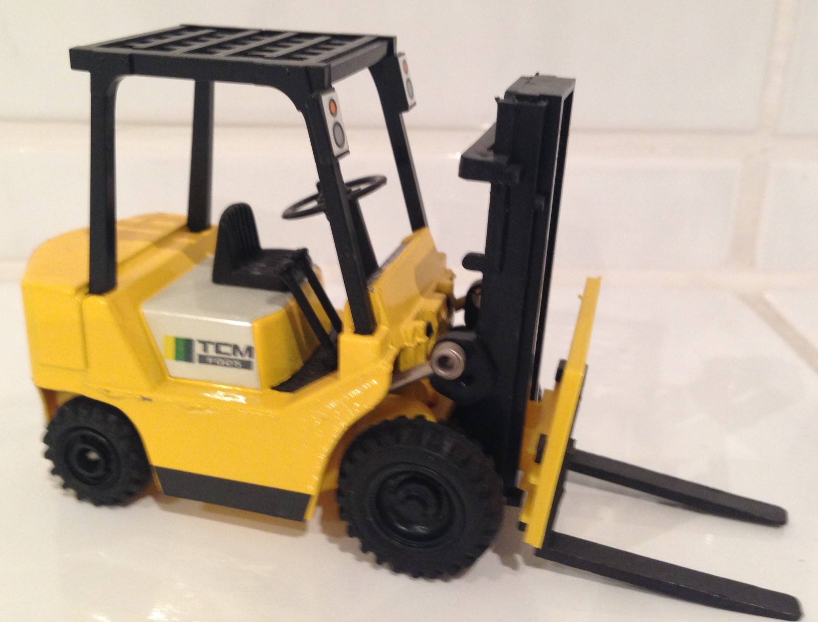 TCM ( = unicarriers ) LIGHT yellow forklift fork lift truck