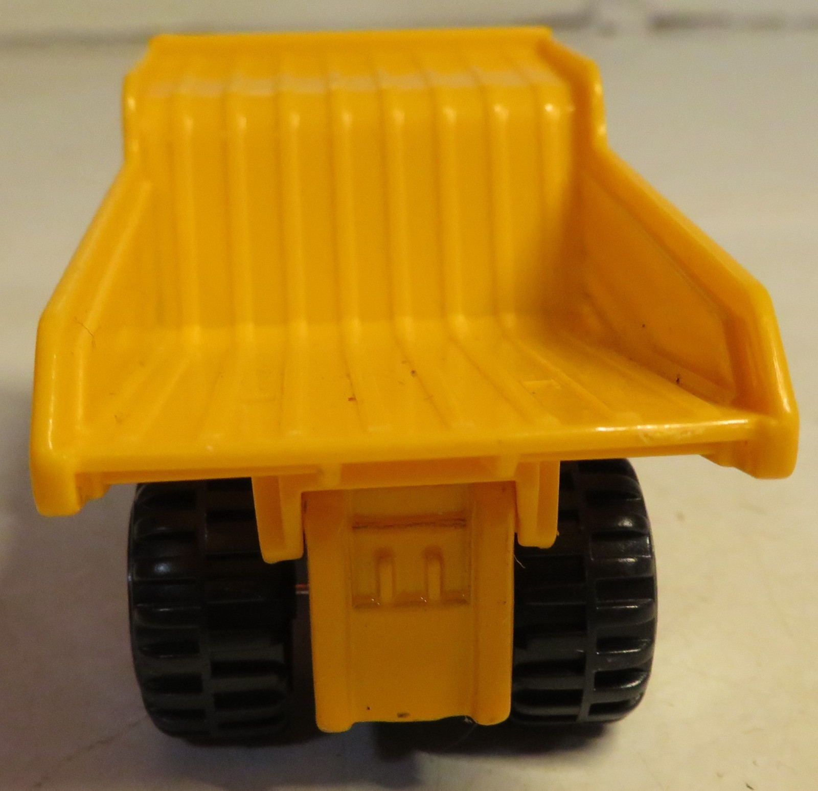 Hercules Classic Construction Toy 3″ Long Dump Truck Yellow Plastic Grading Haul