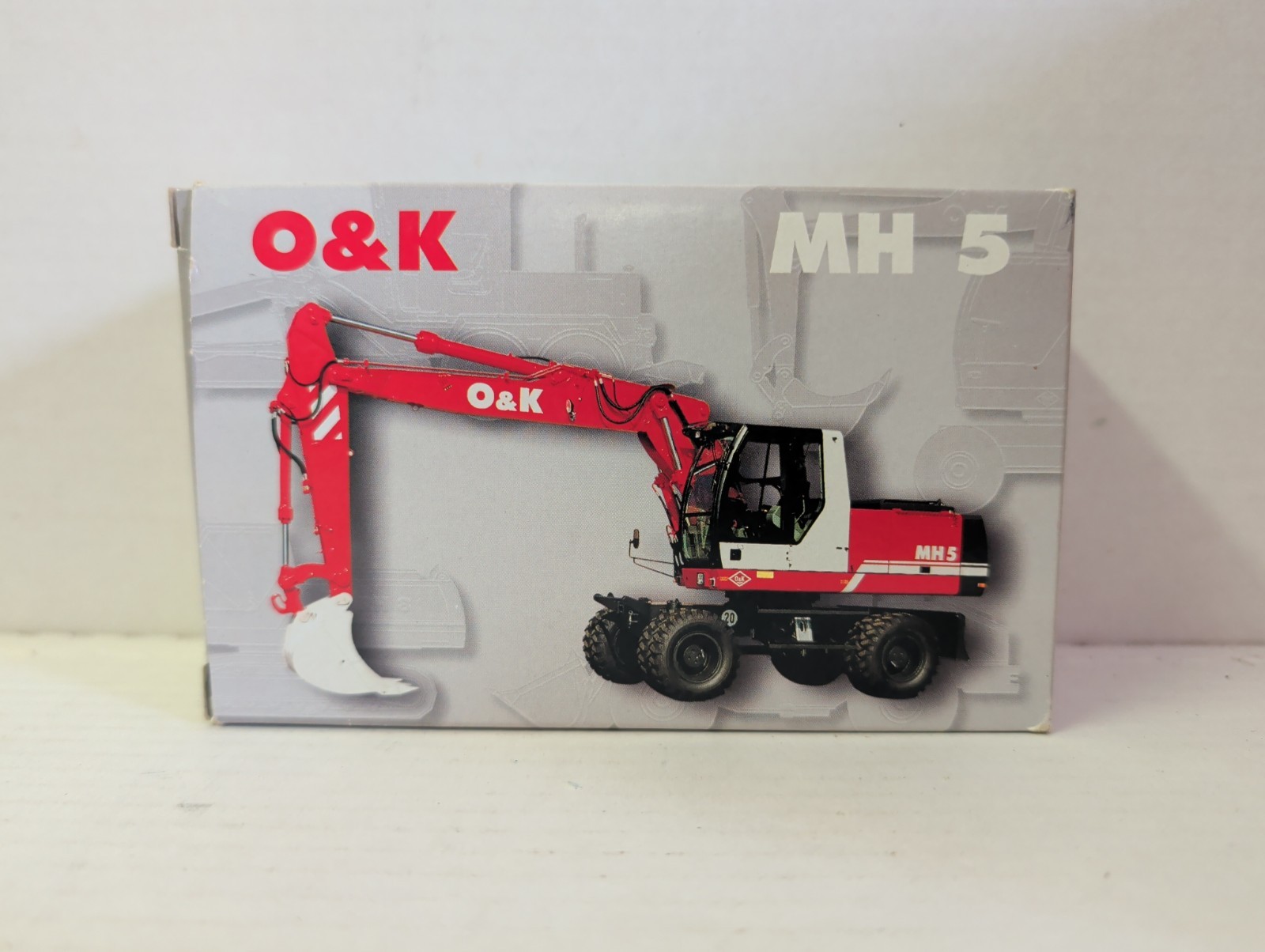 NZG 457 O&K MH5 Wheeled Excavator – Die-cast 1/50 LN