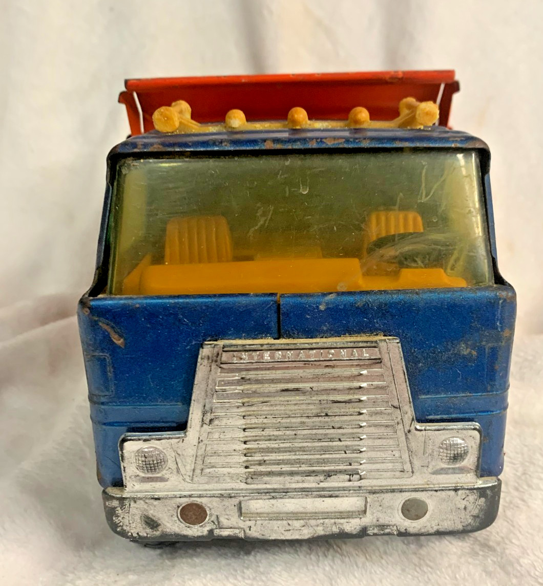 VINTAGE ERTL TRANSTAR BLUE CAB AUTOMATIC DUMP TRUCK ORANGE. (1)