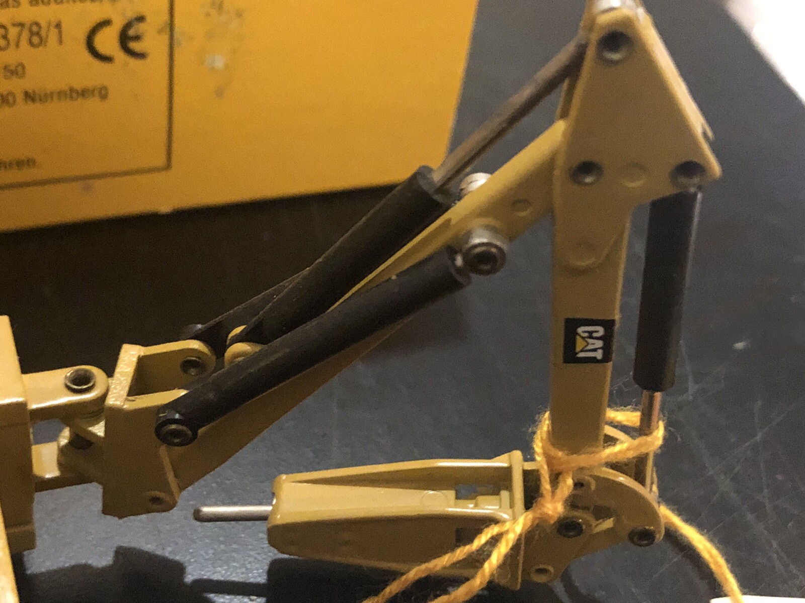 NZG #378 CAT Caterpillar 428 Backhoe Loader w/ Hammer – 1:50 – Limited Edition