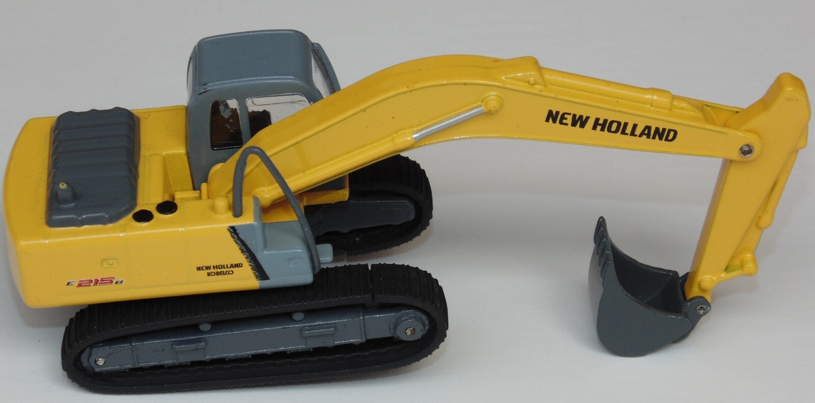 NEW HOLLAND E215B RETROEXCAVA MAQUINARIA PARA CONSTRUCCION 1:87 DIECAST COLOMBIA