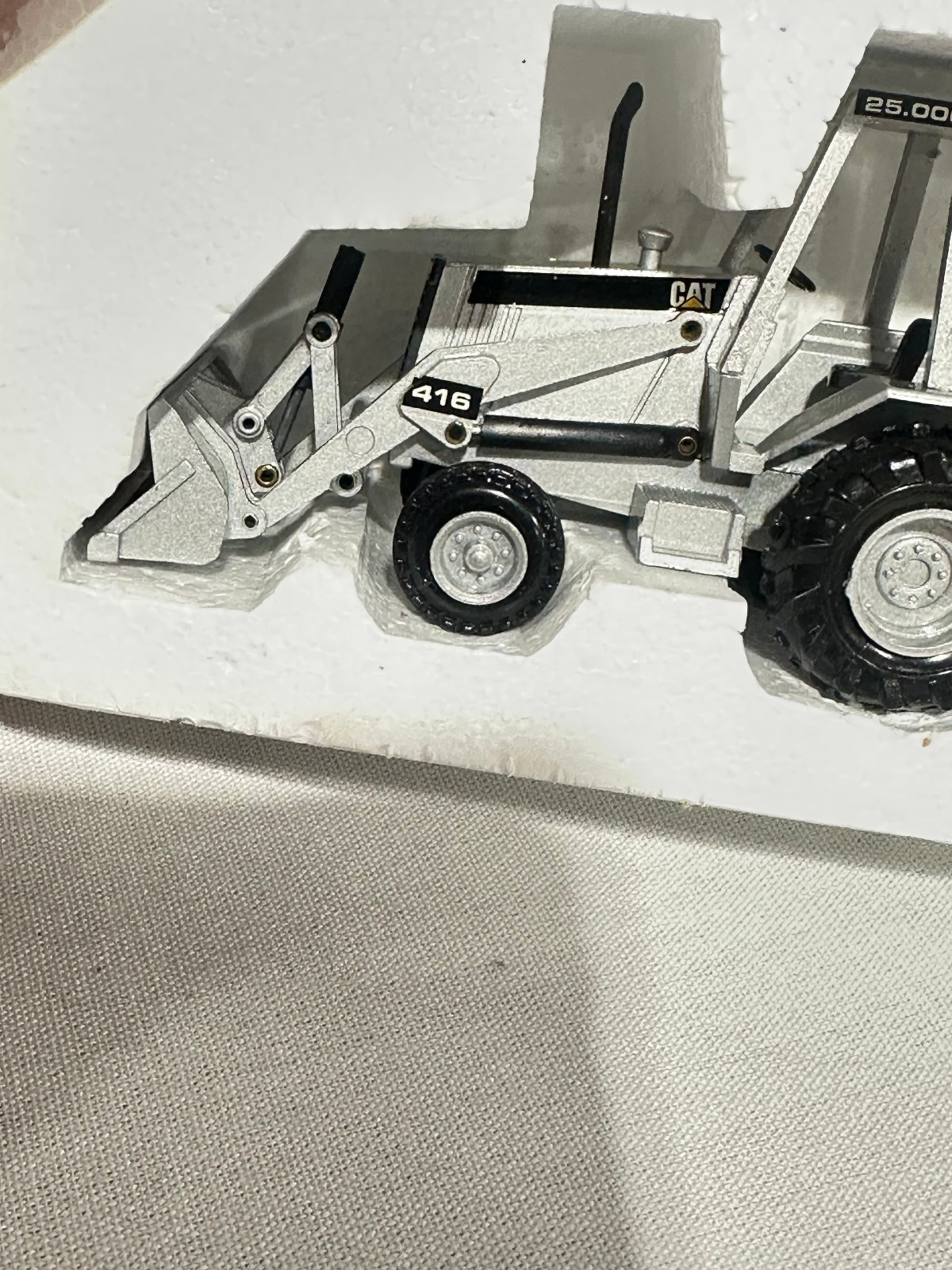 Caterpillar 416 Backhoe Loader 25,000th Silver Edition By NZG 1/50th Scale
