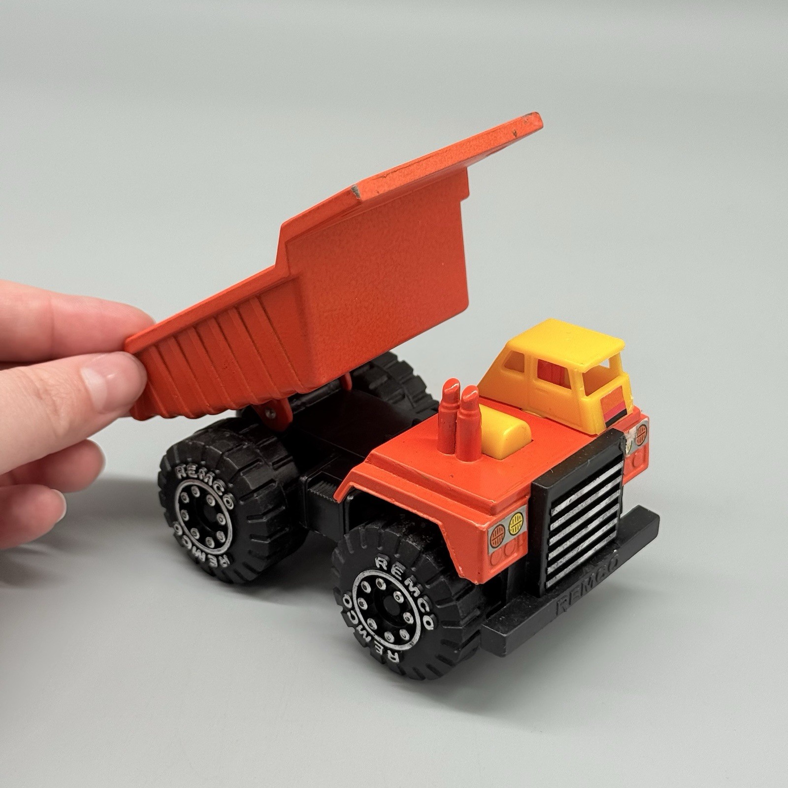 Vintage 1987 Remco Classic Orange Dump Truck Chunky Plastic Diecast 4”