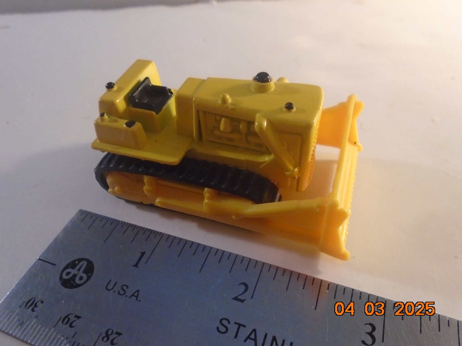 Unbranded Cat Bulldozer, new, 2 3/4″ yellow.