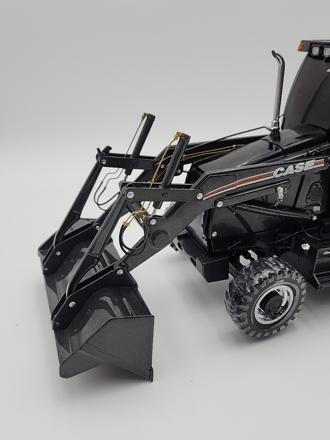 ERTL Case 580 Super M Series 2 Loader Backhoe 50th Anniversary Black 1/16