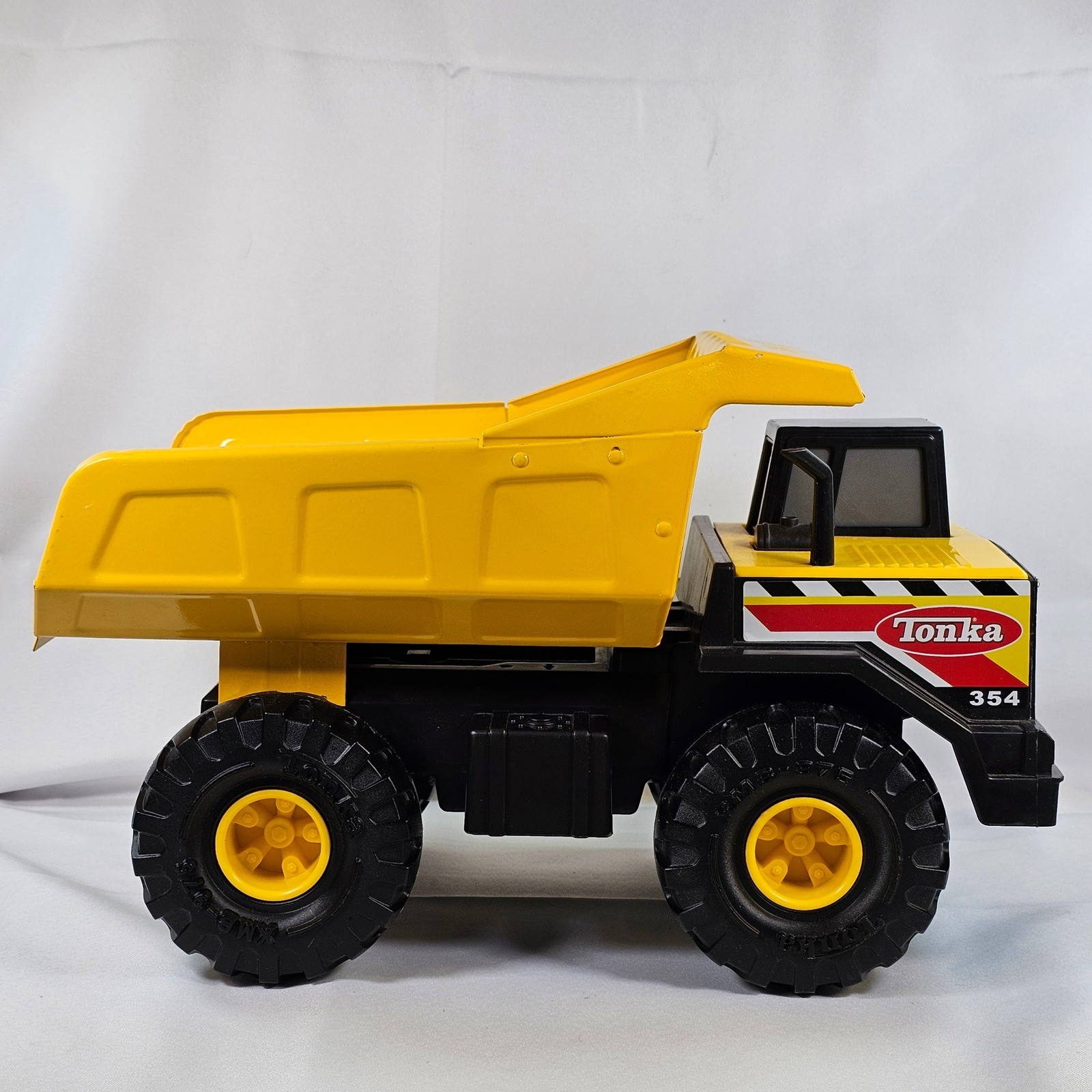 Tonka 354 Mighty Dump Truck Yellow Steel Bed Construction Toy Vehicle 17 Inch