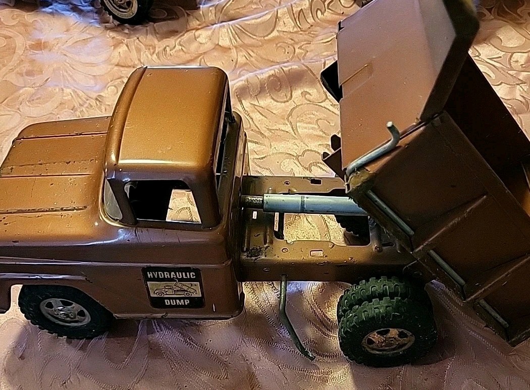 Vintage Tonka Hydraulic Bronze Dump Truck Toy Very Good Condition.