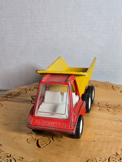This vintage 1969 Gabriel Industries Inc. metal dump truck