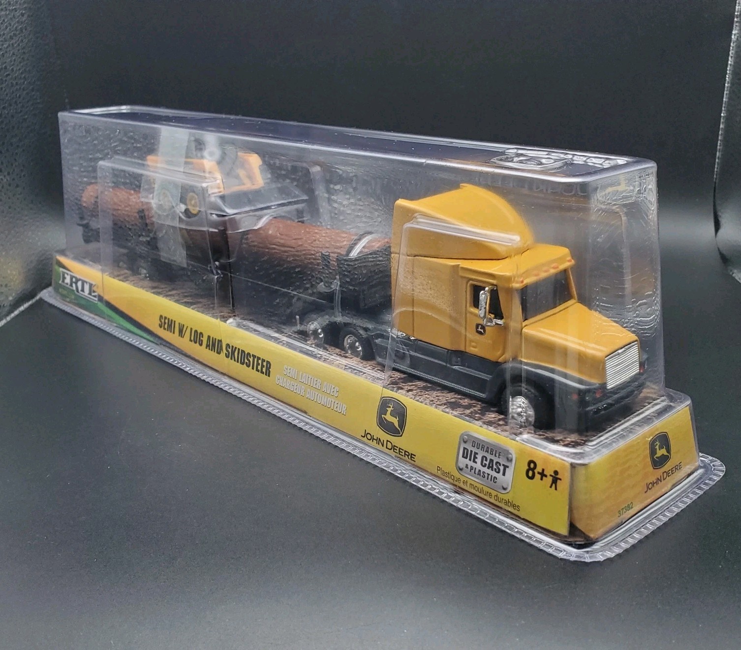 JOHN DEERE – ERTL SEMI W/ LOG AND SKIDSTEER 37382